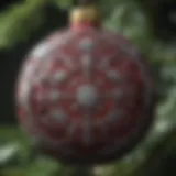 A close-up view of an NC State Christmas ornament showcasing intricate designs